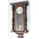 A Vienna wall clock with two train, spring driven movement, chiming on a gong. 6" 2 piece dial