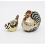 Two Royal Crown Derby paperweights with gold stoppers and boxes of a farmyard cockerel and a fairy