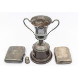 A collection of early 20th Century silver to include two various cigarette cases and a two handled