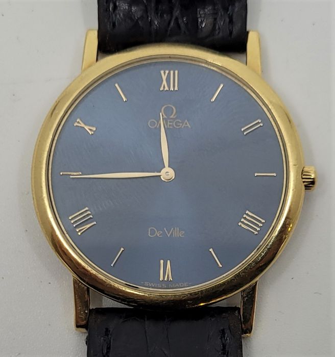 An Omega De Ville 18ct. yellow gold gentleman's quartz wrist watch, cal. 1478, having dark blue