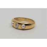 A precious yellow metal, diamond and pearl ring, gypsy set old-cut diamond to centre and pearl to