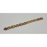 A 9ct. gold fancy link bracelet, length 18.5cm. (18.2g)