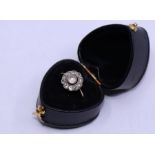 A 9ct. yellow gold and paste set cluster ring, gross weight 1.5g, in associated box, size approx. UK
