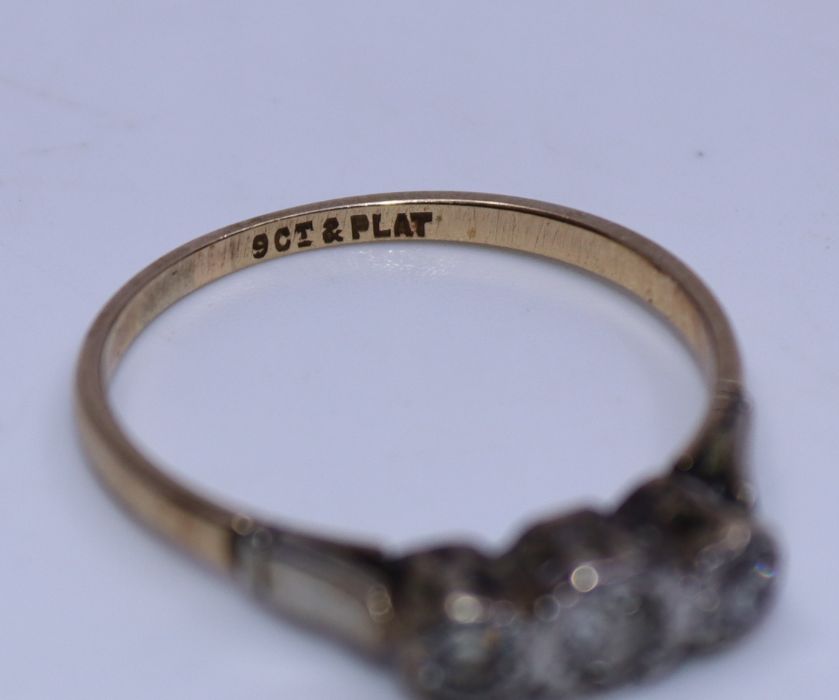 A 9ct. yellow gold and platinum three stone diamond ring,  flush set three graduated old-cut - Image 3 of 3