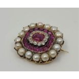 A Victorian precious yellow metal ruby, diamond and natural pearl brooch, the raised centre set
