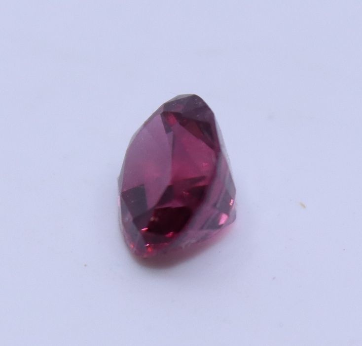 An oval mixed cut spinel, (7.5mm x 6mm x 4.5mm, approx. weight 1.0 carats +) - Image 2 of 3