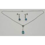 An Art Deco style blue zircon drop pendant necklace together with a pair of drop earrings on