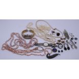 A collection of costume jewellery and watches