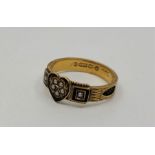 A Victorian 15ct. yellow gold, black enamel and pearl set memorial ring, having black cloissone