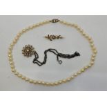 A cultured pearl necklace, with 9ct. gold clasp set three graduared pearls, length 49cm. together