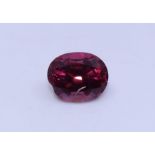 An oval mixed cut spinel, (7.5mm x 6mm x 4.5mm, approx. weight 1.0 carats +)