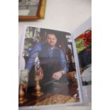 A large collection of Autographs from Film and Tv housed in black case a number framed and in 5