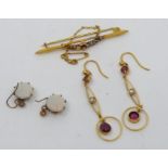 A selecton of gold jewellery to include a pair of round opal earrings in yellow metal, tests as 9ct;
