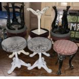 A set of eight various 20th Century cast iron barstools; plus one cast iron stool frame (9)