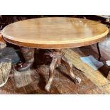 A Victorian mahogany loo/breakfast table, circa 1870, oval moulded edge tilt top, on a turned