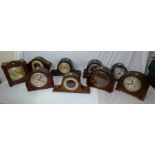 A quantity of mantle clocks in two boxes; including silver chaptered wedding souvenir of R.W Randall