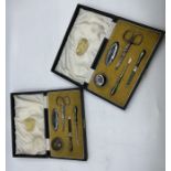 Pair of cased early 20th Century, silver handled manicure sets, assayed Birmingham 1919 - both