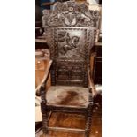 A Charles I revival oak wainscot chair, carved scrolling top with a Duke of Devonshire coat of arms,