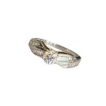 A hall marked 18ct gold dress ring (size q 1/2) with the principal diamond having an estimated