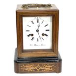 A French late 19th century rosewood and marquetry mantel clock, gilt metal handle and bevelled glass