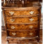 A George III revival crossbanded mahogany bedside chest of drawers, bow front with a moulded edge