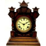 An American Ansonia clock of New York mahogany cased, arch shape carved top, 6inch brass frame