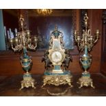 A French style marble and gilt metal three-piece clock garniture by Franz Hermle, in a Rococo