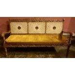 An Indonesian oak bergere living room suite three seater sofa with three matching armchairs, two