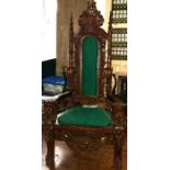 A Regency influenced hardwood throne type chair, turned pointed finials scrolling arch top with