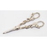 A pair of Victorian style silver grape scissors, the handles cast with foxes on grape vines,