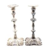A matched pair of George II silver candlesticks, hallmarked by William Cafe, London, 1757 & 1758,