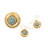 A Victorian and turquoise Etruscan style circular gold brooch/pendant, the centre raised, set with