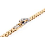 A diamond and sapphire 18ct gold leopard bracelet, the front comprising a leopard head pave set with