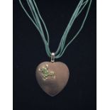 A Victorian 15ct gold heart shaped locket, comprising a heart approx 35 x 38mm with an applied