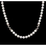 Mikimoto- a cultured white pearl and 18ct gold  necklace, comprising a single row of uniform
