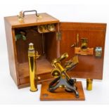 A 19th century lacquered brass monocular microscope, R & J Beck London, with various accessories and
