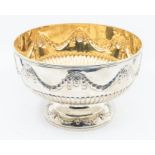 A Victorian silver rose bowl, Neo-Classical style the upper section chased with a band of swags