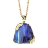 An opal and diamond set 14ct gold pendant, comprising an organic shaped boulder opal with blue