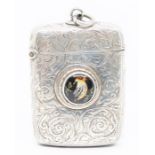 A Victorian silver vesta case, with a central cabochon depicting a bird, hallmarked by Minshull