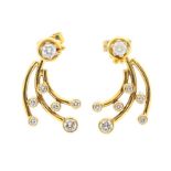 A pair of two way diamond and 18ct gold earrings, comprising a round brilliant cut top, claw set