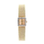 Omega- a ladies diamond set 18ct gold Omega wristwatch, square gold tone dial with baton markers,