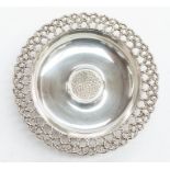 A Modernist silver dish with pierced silver gilt circumference, hallmarked by Stuart Devlin,