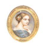 A 19th century oval portrait of a young lady, wearing flowers in her hair and blue shawl, reverse