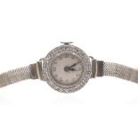 A ladies Art Deco diamond and platinum cocktail watch, round silvered dial with Arabic number