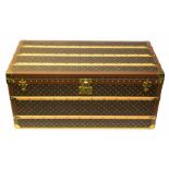 A Louis Vuitton Malle Haute 110 trunk, in monogram canvas with natural cowhide leather handles,