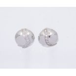 A pair of diamond and 18ct white gold earrings, comprising a dome with an applied diagonal row of