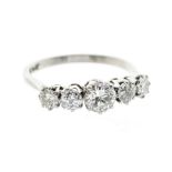 A five stone diamond and platinum ring, comprising five round brilliant cut diamonds, assessed