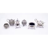 An Asian low grade silver / white metal matched condiment set, the salt with stamp to base
