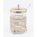A George V silver condiment jar holder and cover, the body with reticulated geometric design on