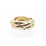 Cartier- a vintage diamond set 18ct gold Cartier  'Trinity' ring, comprising three gold bands each